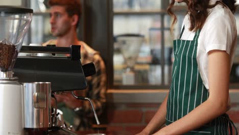 smiling barista serving a client