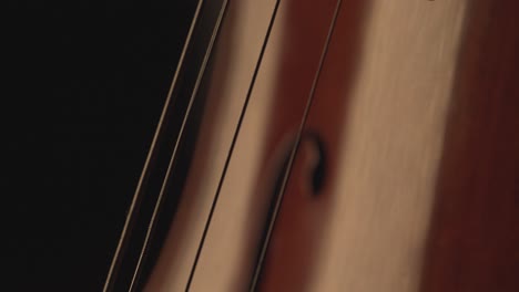 close-up-of-cello,-cello-bow-,-cello-playing-and-strings