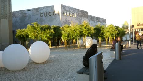 gucci store with outdoor garden and seating area