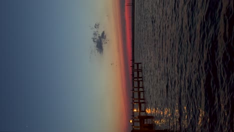 Fishing-dock-during-dusk-vertical-video