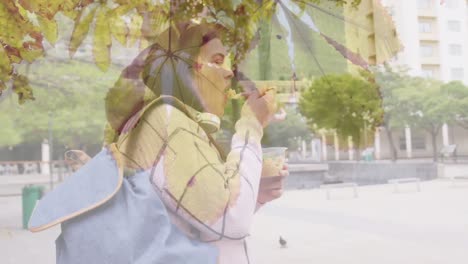 animation of spots of light over caucasian woman eating take away lunch in city street