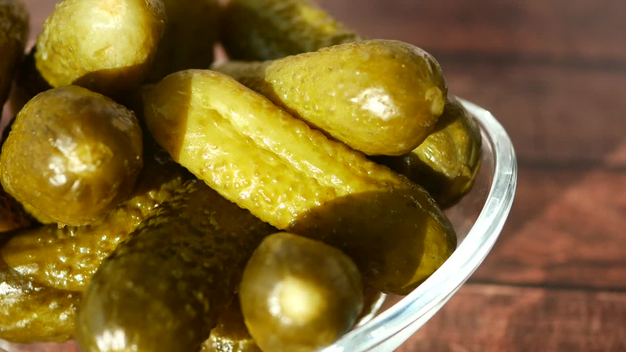 Closeup of a bowl of dill pickles