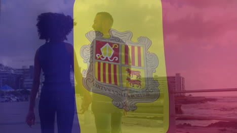 walking seaside promenade, couple with andorra flag animation overlaying them
