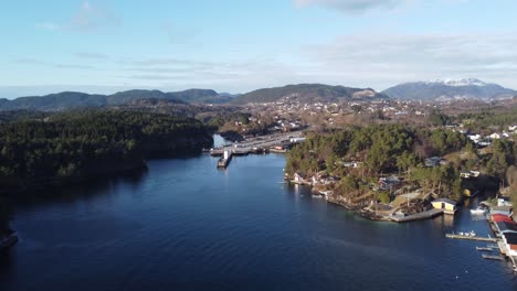 Bay-of-Halhjem-with-E39-ferry-pier---Sunny-day-beautiful-aerial-approach