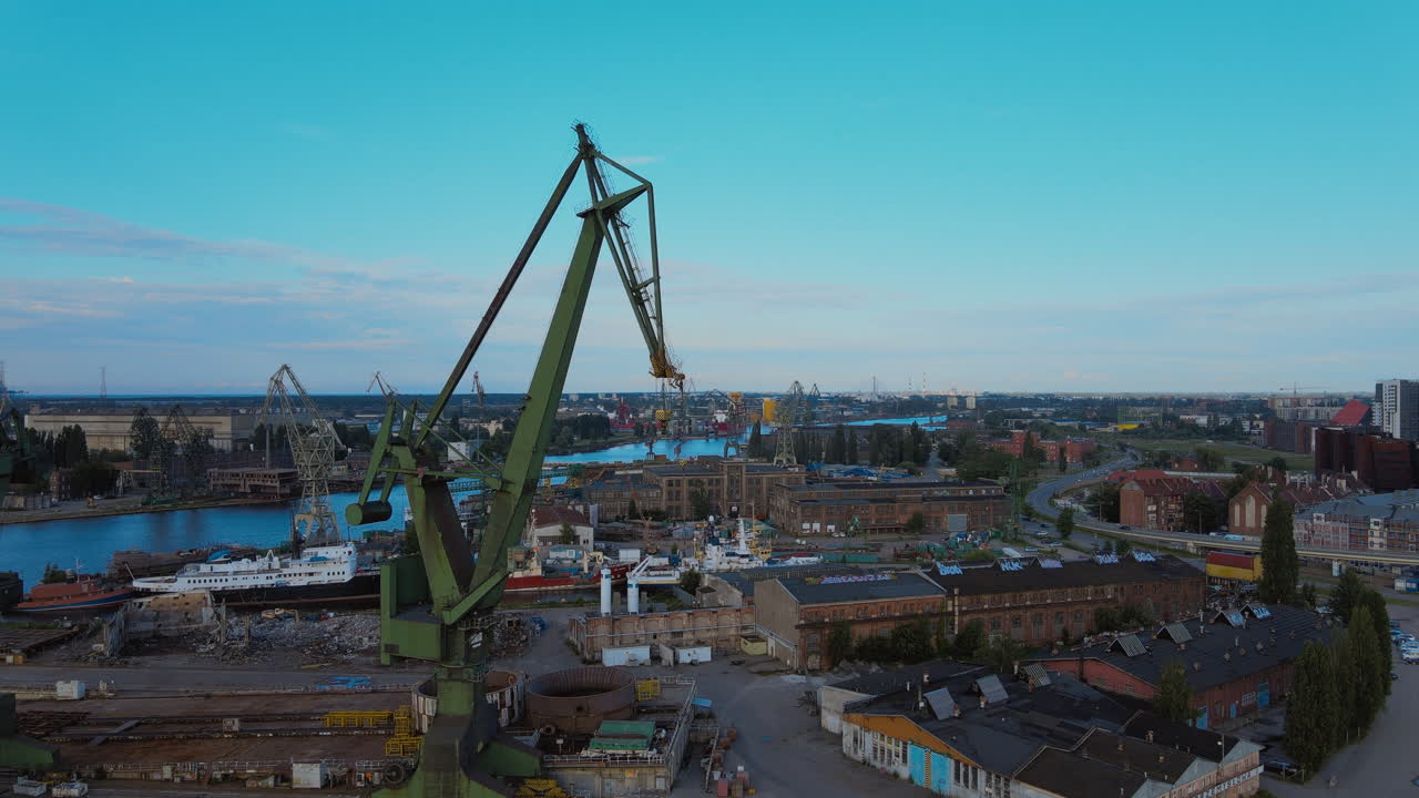Drone shot of Cranes In Gdansk Shipyard and closed industry area for import and export