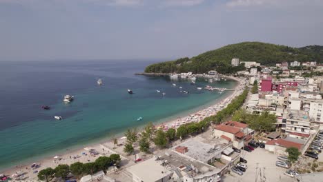 Aerial-of-the-idyllic-shoreline-of-Himare,-relaxing-getaway-in-Albania