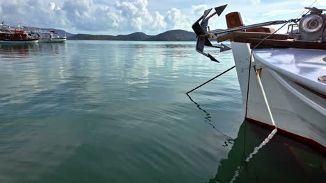 moored boat in port of crete island, close up static view