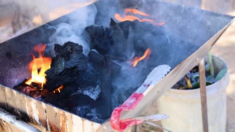 igniting charcoal on a barbecue grill over time