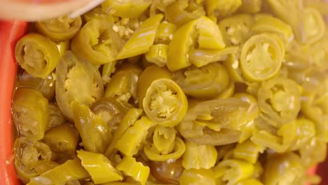 close-up of pickled green peppers