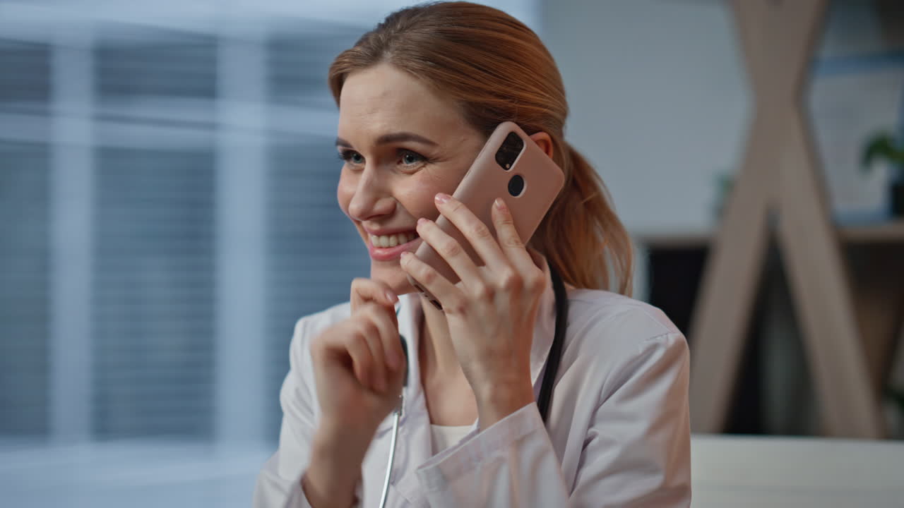 Professional reviewing medical scan on call closeup. Joyful therapist in clinic