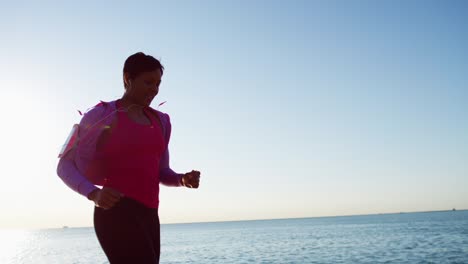 african american female in sun flare running outdoors