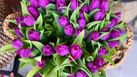 purple tulip bouquet in a basket