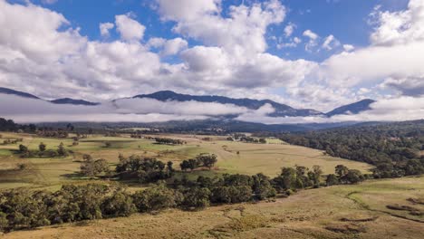 morning mists give way to blue skies over a horse ranch in the snowy mountains, nsw, australia