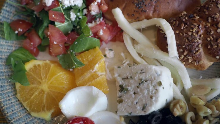 Healthy Breakfast Plate with Cheese, Olives, and Orange Slices