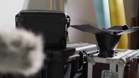 close up of film camera lighting and sound recording equipment flight cases for movie or video in studio 1