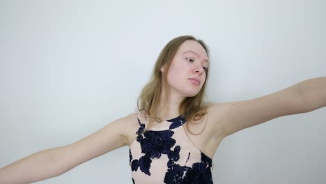 thoughtful expression female dancer's graceful white room dance