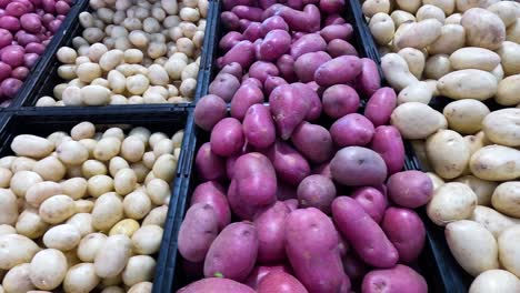 various potatoes on display at market