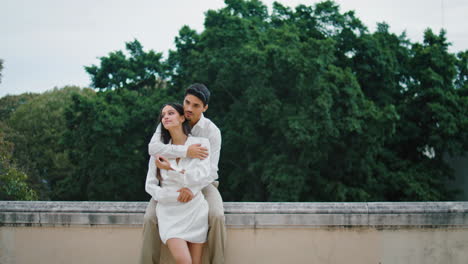 love couple hugging cityscape place vertically. romantic man woman enjoying date