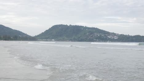 the-beach-with-white-sand-and-calm-wave-from-peaceful-sea-in-summer-sunshine-daytime