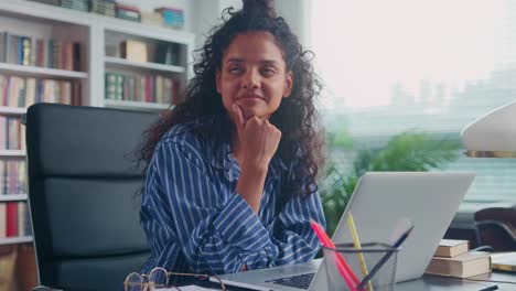young ethnic indian woman unable to concentrate working or studying on laptop
