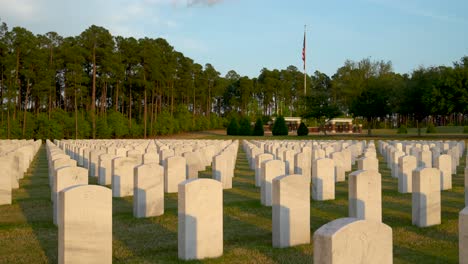 wide shot of tombstones at fort jackson national cemetery in south carolina at sunset