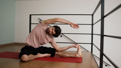 Man-stretching-at-home-floor,-slow-motion