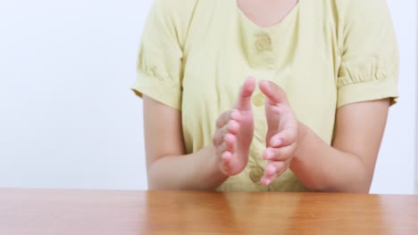 a close-up view of hands clapping symbolizing joy and connection a serene indoor setting