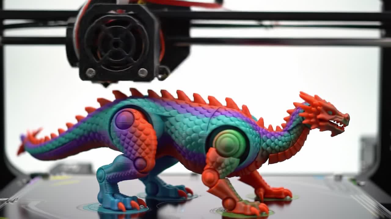 A Colorful 3D Printed Dragon Figurine in the Process of Creation: An Eye-Catching Blend of Materials and Technology Showcasing Unique Design and Craftsmanship