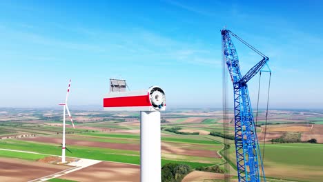 Wind-Turbine-Head-During-Construction-With-Crane---drone-shot