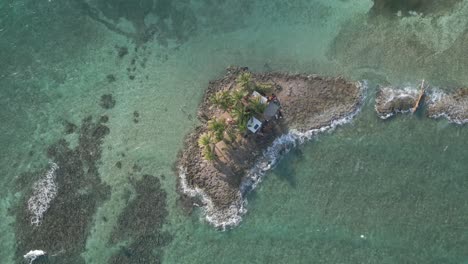 aerial over small caribbean rocky cay