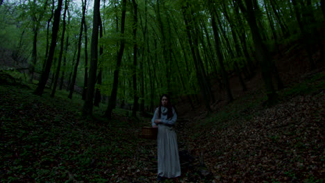 woman with basket in the forest