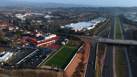 aerial pull back shot over a suburban city angle 2 with bridge