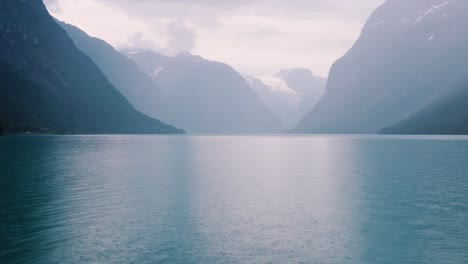 abstract background, rain drops on the water. beautiful nature norway natural landscape. lovatnet lake lodal valley.