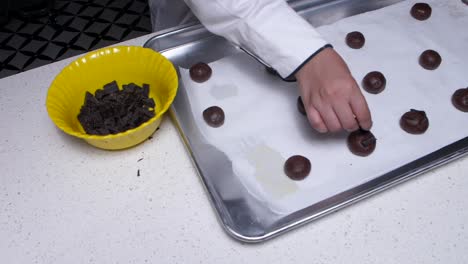 putting chocolate on cookies at top angle