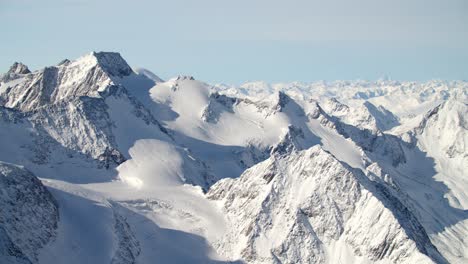 Mountain-Panorama-in-the-alps-with-fresh-snow-on-a-glacier-ski-resort-in-Tirol