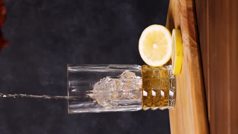 Piscola-cocktail,-Typical-Chilean-drink-wooden-table-dark-background-Chile-Pisco,-Ice-and-Coke