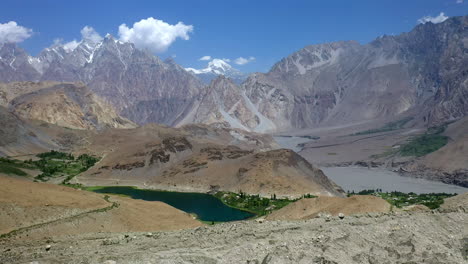 wide drone shot of passu cones pakistan, cinematic wide panning and rising aerial shot