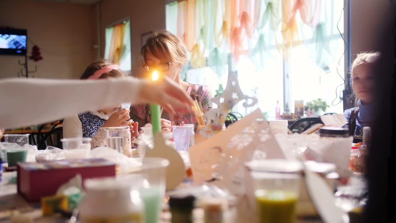 Children learning crafts with their teacher