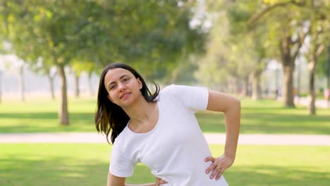 indian woman doing exercise in a park