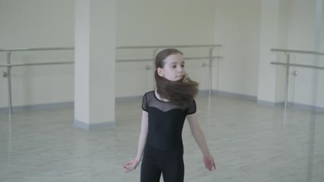 young ballet girl at studio lesson. training performance. stretching exercise pose. ballerina practice balance technique. classical elegance fitness.