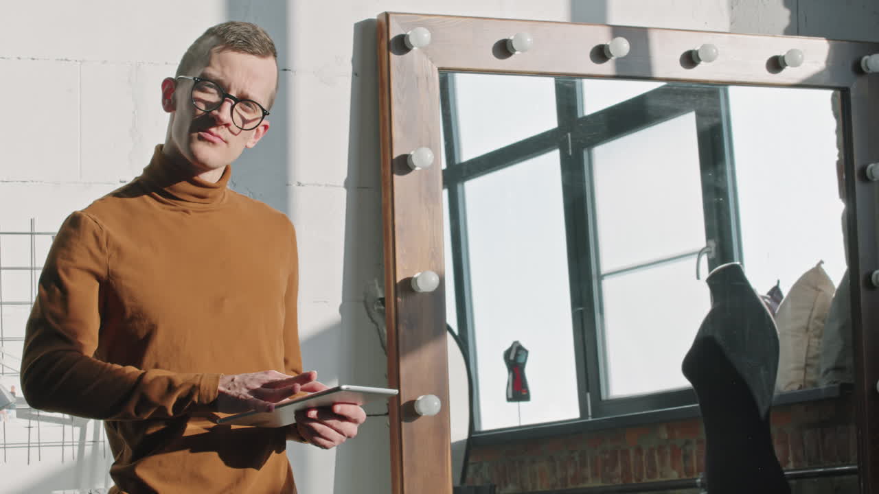 Fashion Designer in Glasses Posing in Workplace