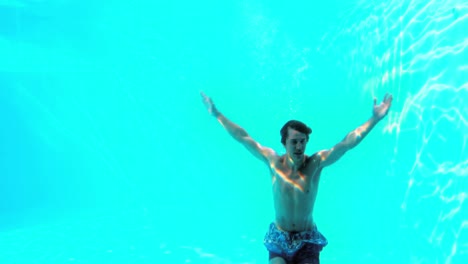 Happy-man-diving-into-swimming-pool