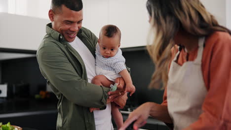 baby, food and a couple cooking in the kitchen