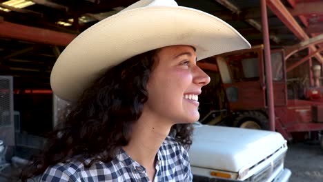 side profile to low angle of beautiful cowgirl