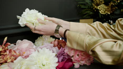 woman hands touching flowers