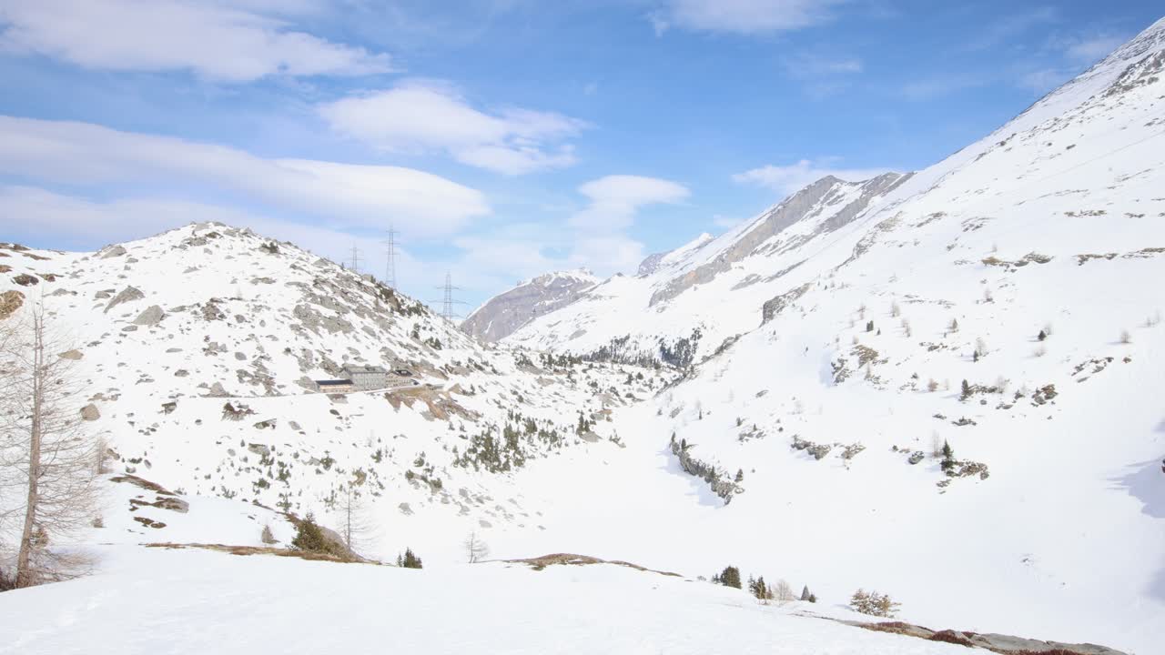 Mountain pass in snow covered alps, establisher