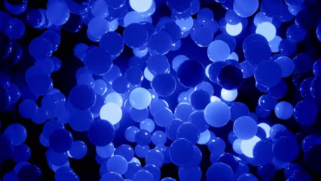 abstract 4k background of spheres in shades of blue. balls like leds hang in air and light up and go out. bright stylish background