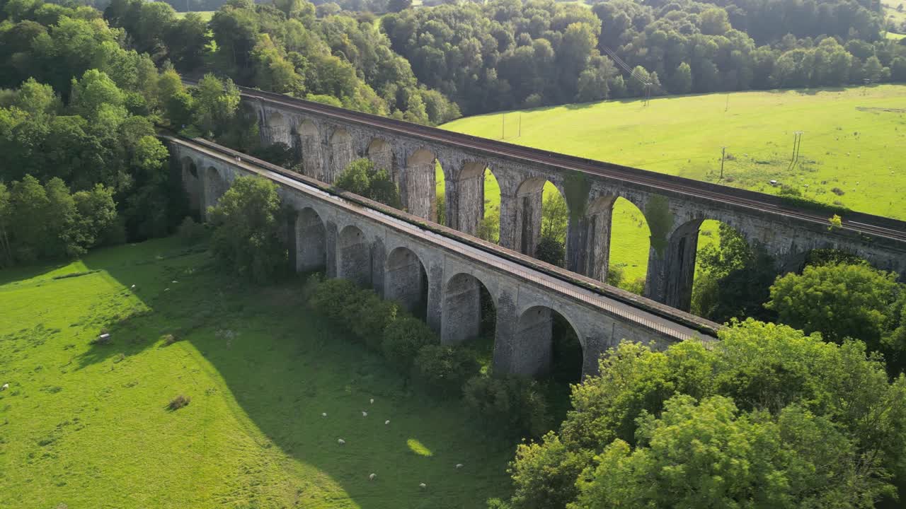 Chirk Aqueduct and railway Viaduct - aerial drone anti-clockwise flyover, revealing canal and railway below - Welsh, English border, Sept 23