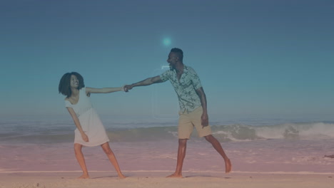 dancing on beach, couple enjoying glowing digital animation in background