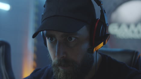 man concentrated on video game
